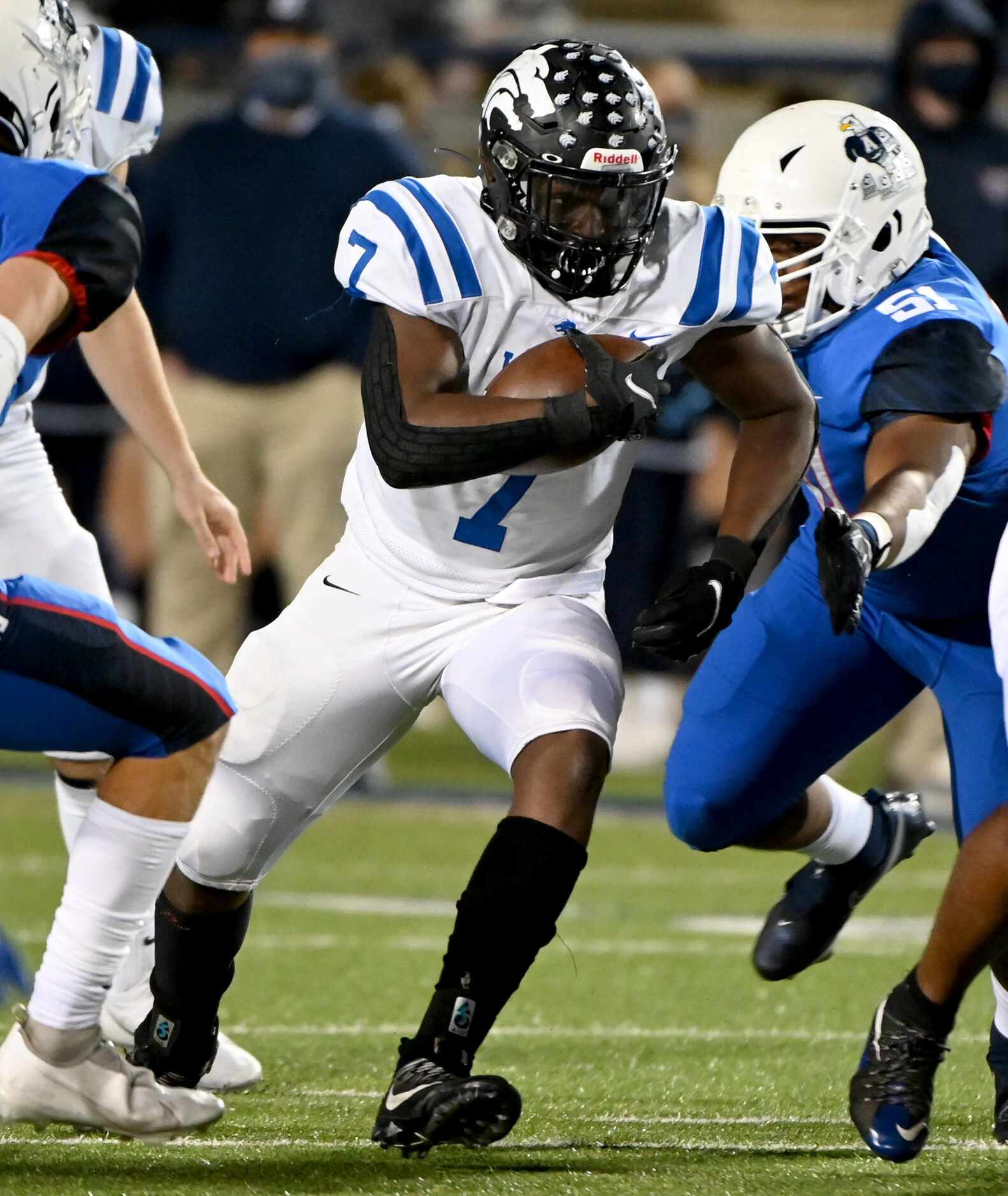 Plano West’s Tabren Yates (7) runs past Allen’s Kaleb Nettles (51) in the first quarter of a...
