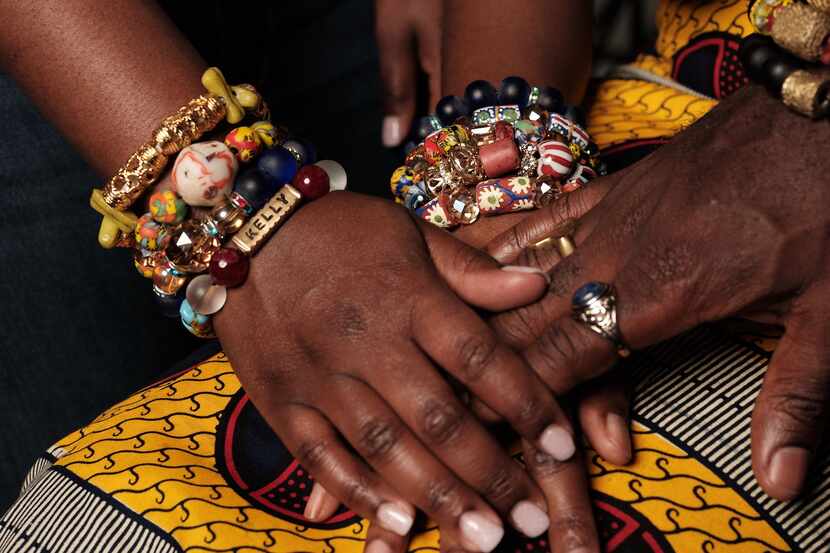 Three Black hands featuring hand-crafted Ghana-inspired bracelets by Gyasi Designs.