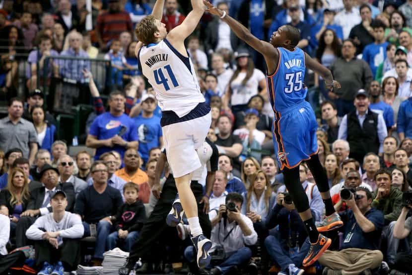 Dallas Mavericks forward Dirk Nowitzki (41) shoots a three over Oklahoma City Thunder...