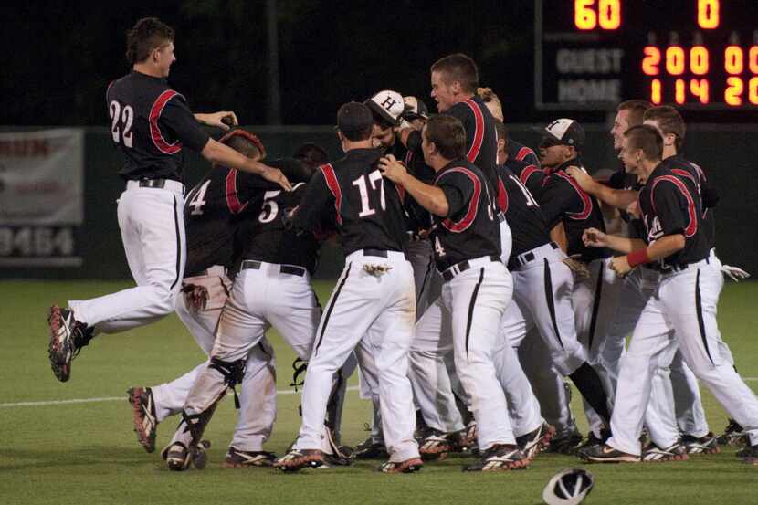 Heath players celebrate in the infield after the final out of their 9-2 win over Wakeland in...