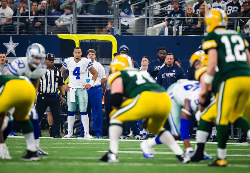 Dallas Cowboys quarterback Dak Prescott (4) watches from the sidelines as Green Bay Packers...