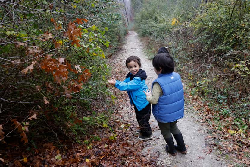 Julio Rios, 3, of Dallas, left, talks with Carmelo Simental, 3, of Dallas during a hike,...