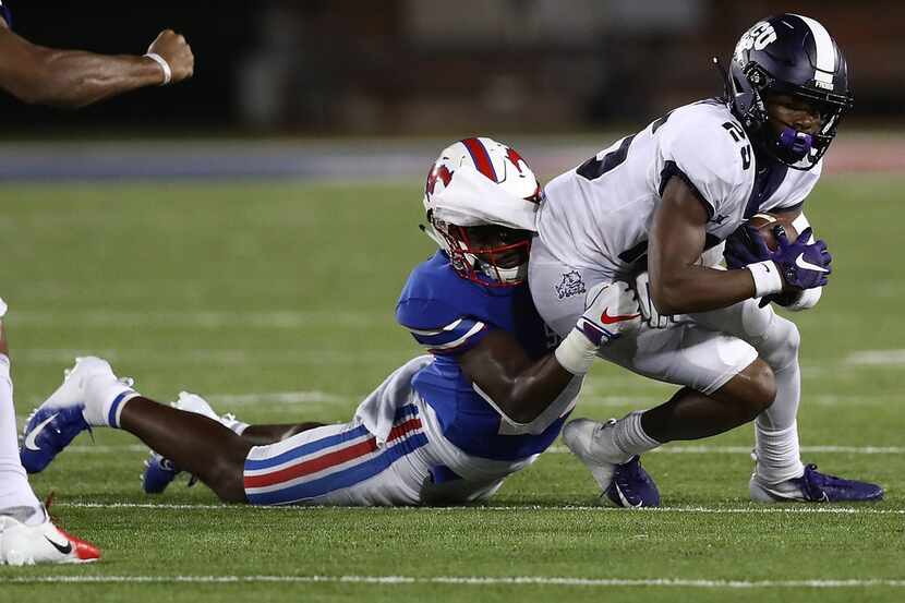 DALLAS, TX - SEPTEMBER 07:  KaVontae Turpin #25 of the TCU Horned Frogs is tackled by...