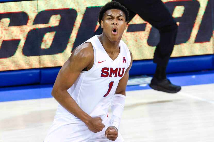 Southern Methodist guard Zhuric Phelps (1) cheers after scoring a point against Texas...