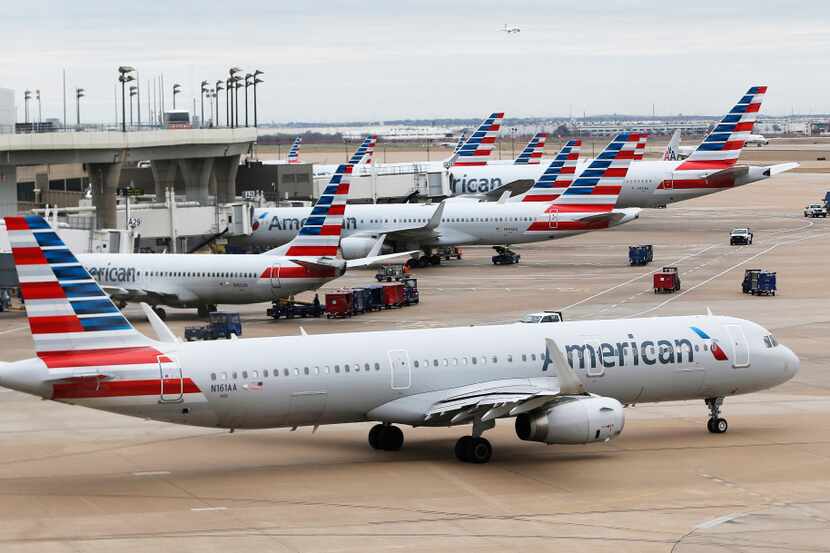 American Airlines planes in between Terminal A and C at DFW International Airport. (Vernon...