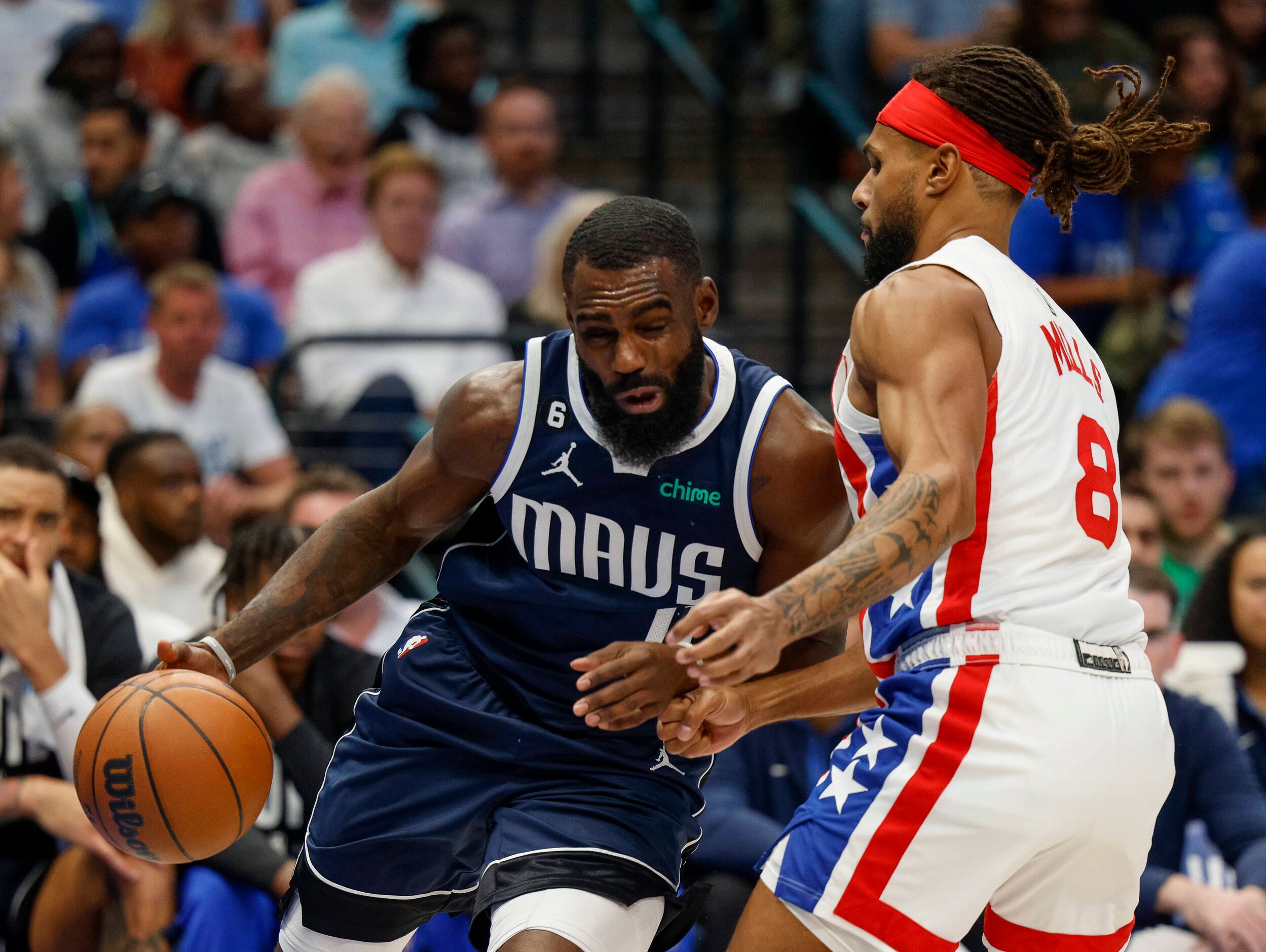 Dallas Mavericks forward Tim Hardaway Jr. (11) collides with Brooklyn Nets guard Patty Mills...