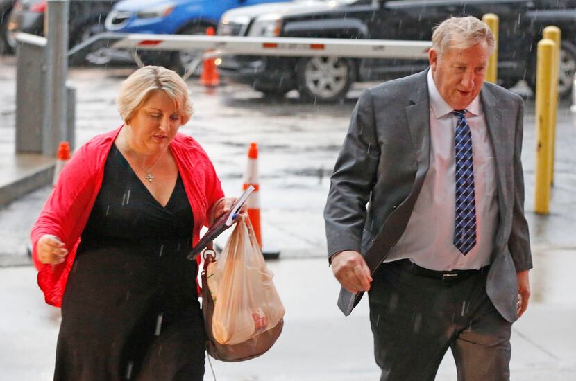 Amy Herrig and her father, Jerry Shults, of the Gas Pipe arrive at the Earle Cabell federal...