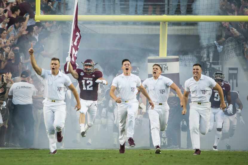 The Yell Leaders break onto the field with the team prior to a matchup between the Texas A&M...