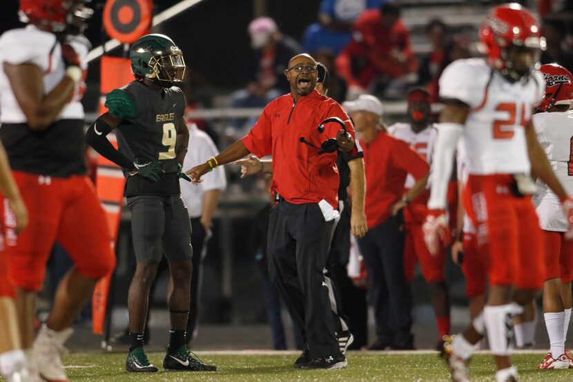 Cedar Hill head coach Carlos Lynn yells to get the attention of the referee following a...