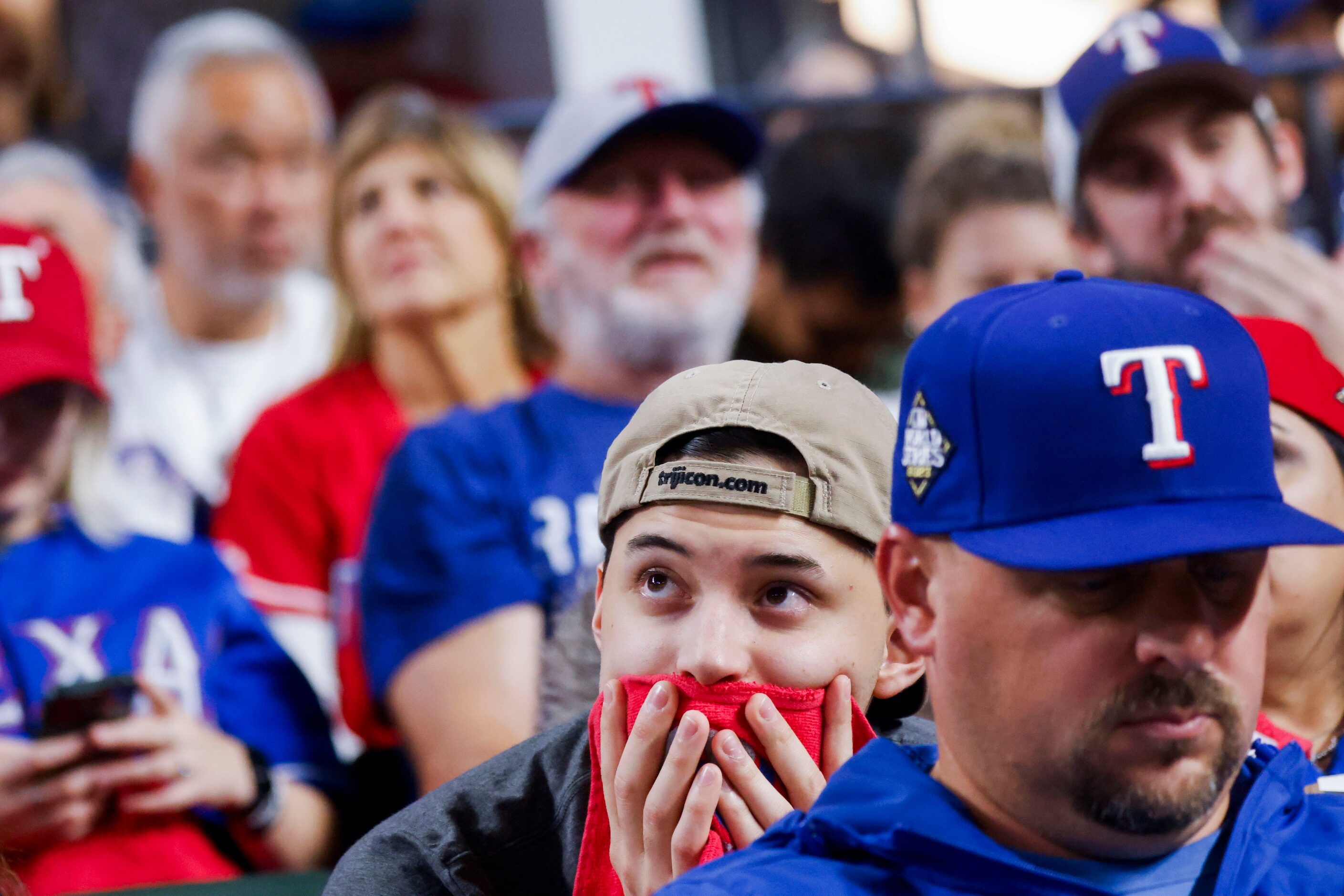 Texas Rangers fans looks dejected after Arizona Diamondbacks won Game 2 of the World Series,...