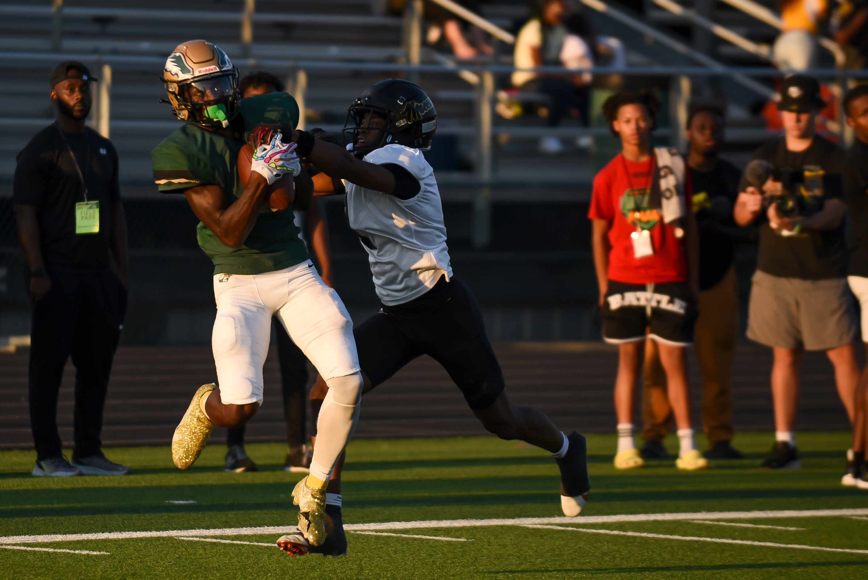 DeSoto senior Johnny Cook II (1) catches the ball over South Oak Cliff senior Manny Muhammad...