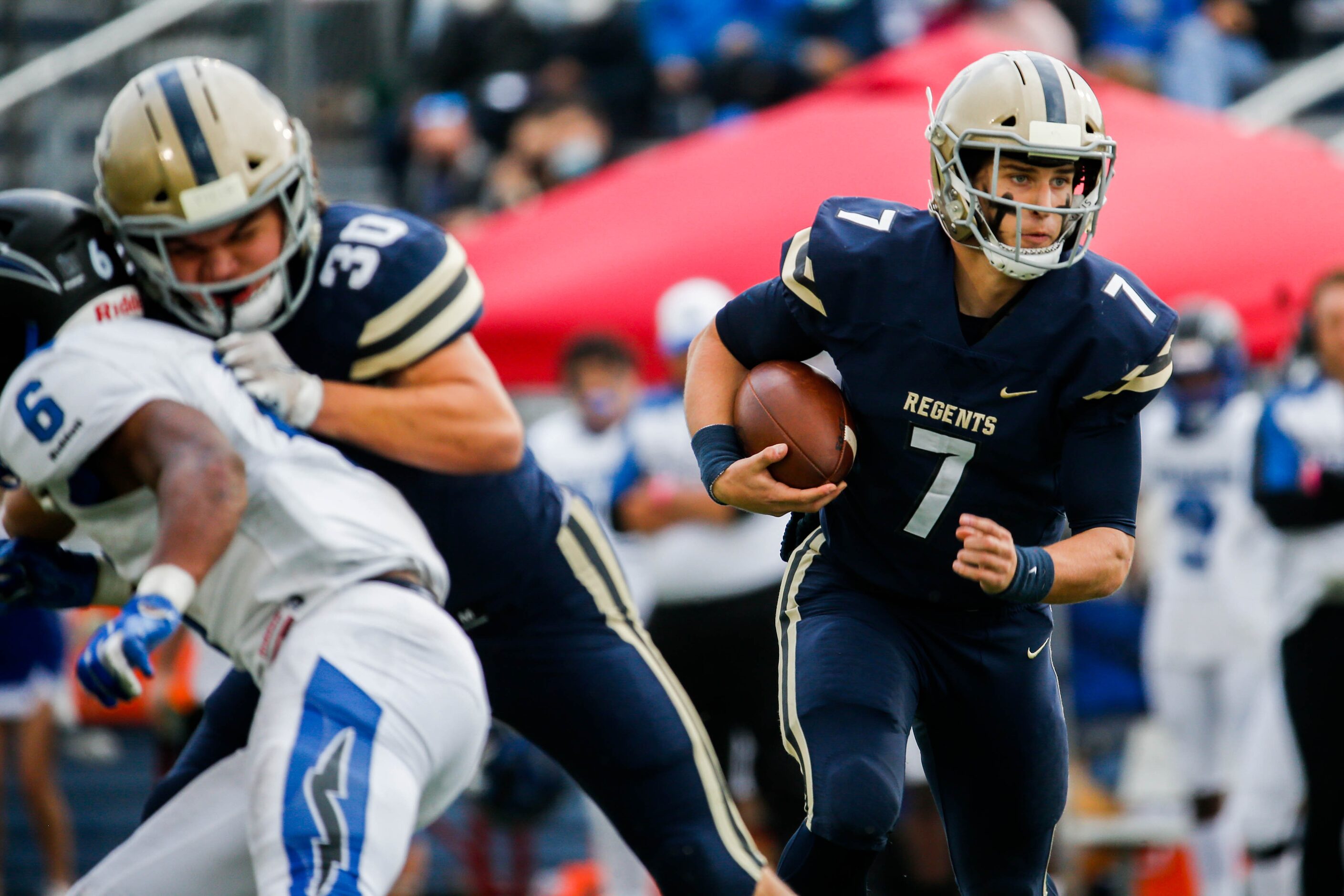 Austin Regents's quarterback Andrew Dickey (7) runs the ball against Dallas Christian during...