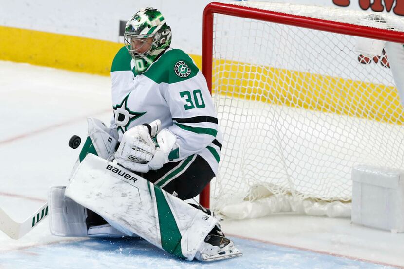 Dallas Stars goaltender Ben Bishop (30) defends the goal during the first period of an NHL...