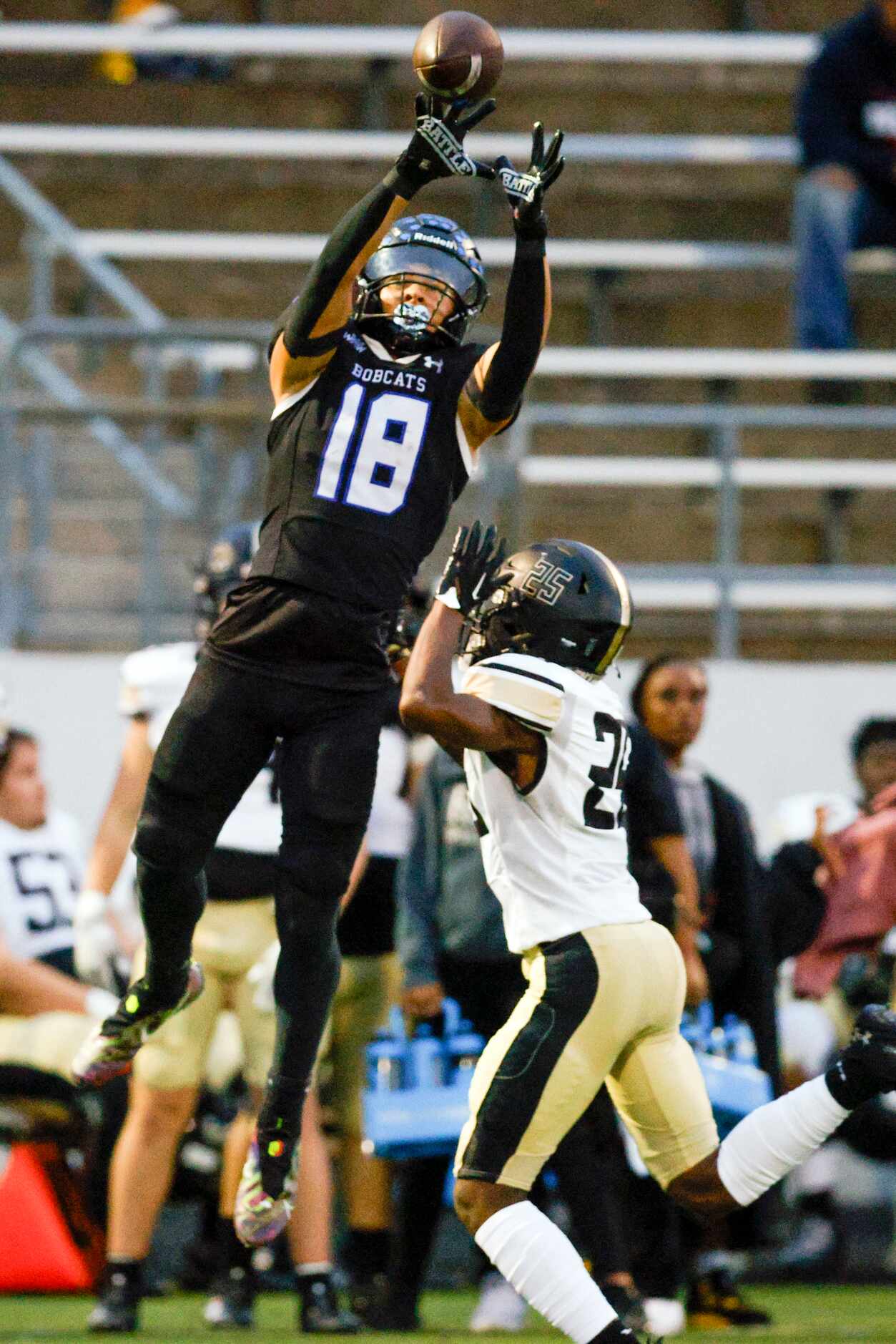 Trophy Club Byron Nelson wide receiver Ezra Malamura (18) makes a leaping catch over Keller...