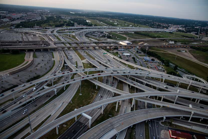 Highway lanes converge for the split between I-30 and I-35E near downtown Dallas. The...