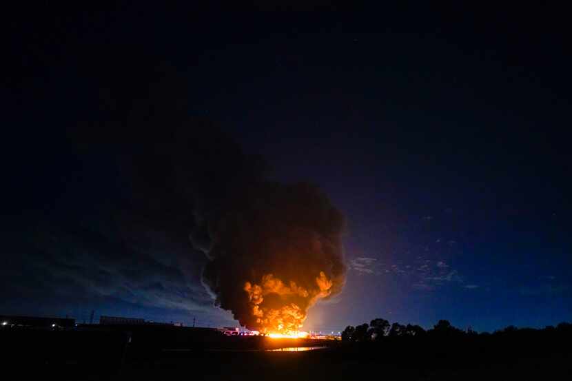 A plume of smoke is seen from a massive fire at  Poly-America on Wednesday, Aug. 19, 2020,...