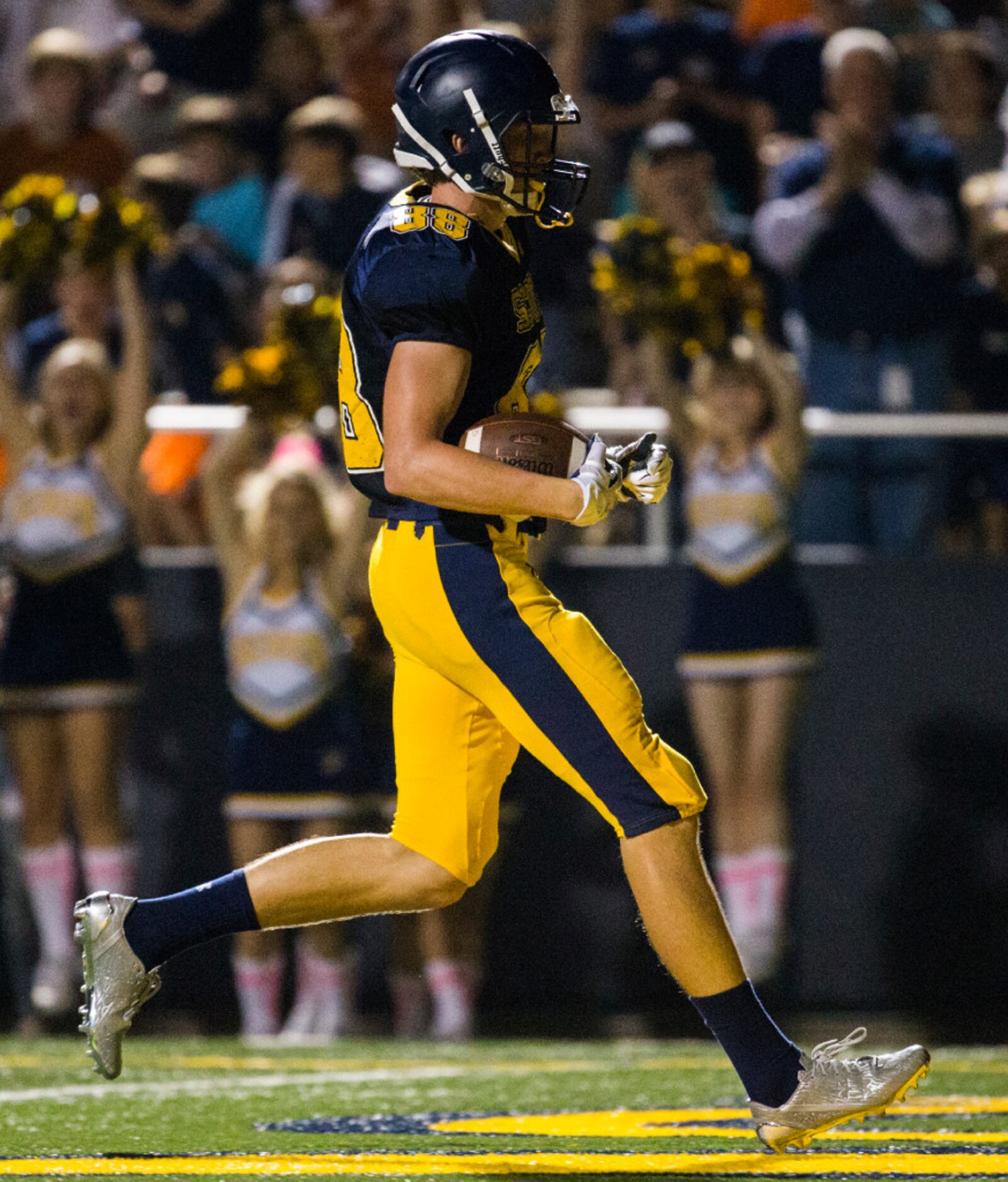 Highland Park wide receiver Cade Saustad (88) runs in to the end zone for a touchdown during...