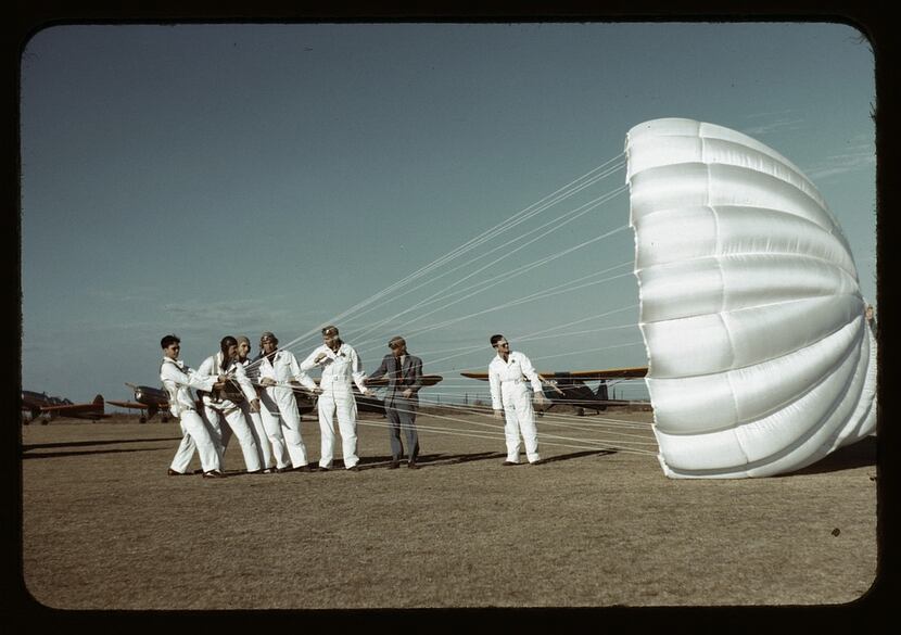 Instructor explaining the operation of a parachute to student pilots, Meacham Field, Fort...