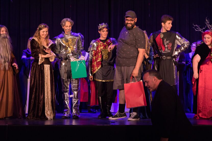 Dallas theater teacher Mark Guerra, third from right, poses with the cast of a production....