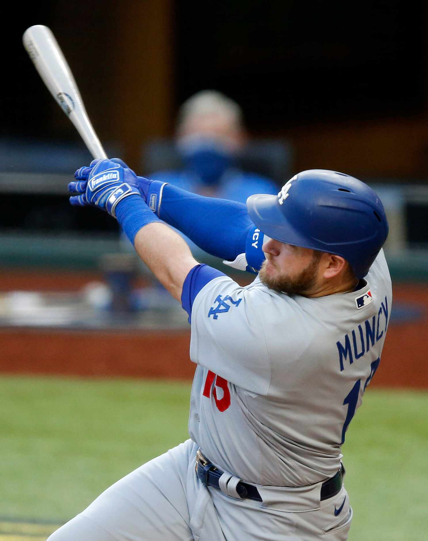 Los Angeles Dodgers batter Max Muncy (13) connects on his first inning grand slam in Game 3...