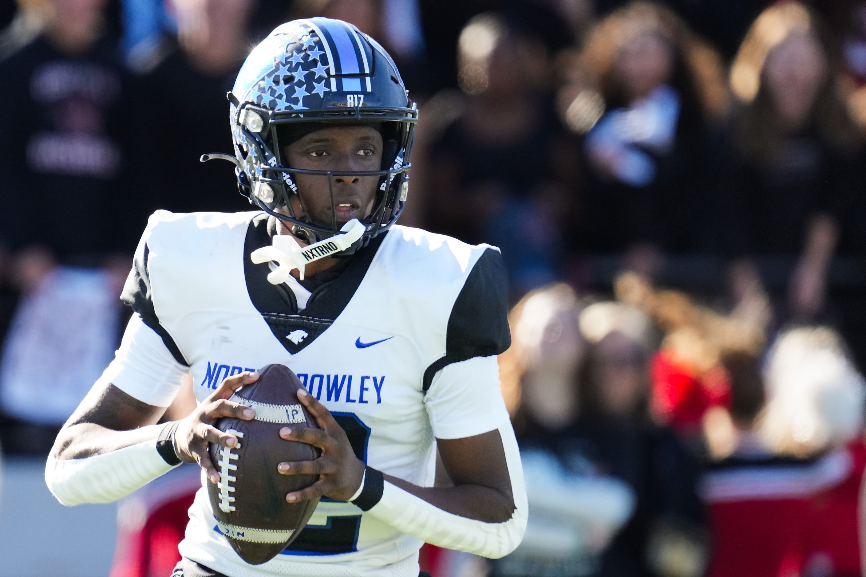 North Crowley quarterback Chris Jimerson Jr. (12) looks to pass during the first half of a...