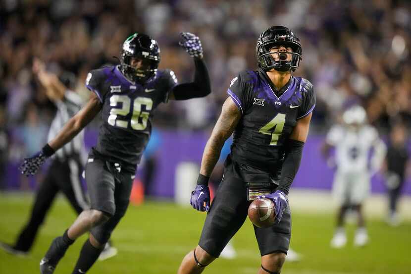 TCU safety Namdi Obiazor (4) celebrates with safety Bud Clark (26) after breaking up a pass...