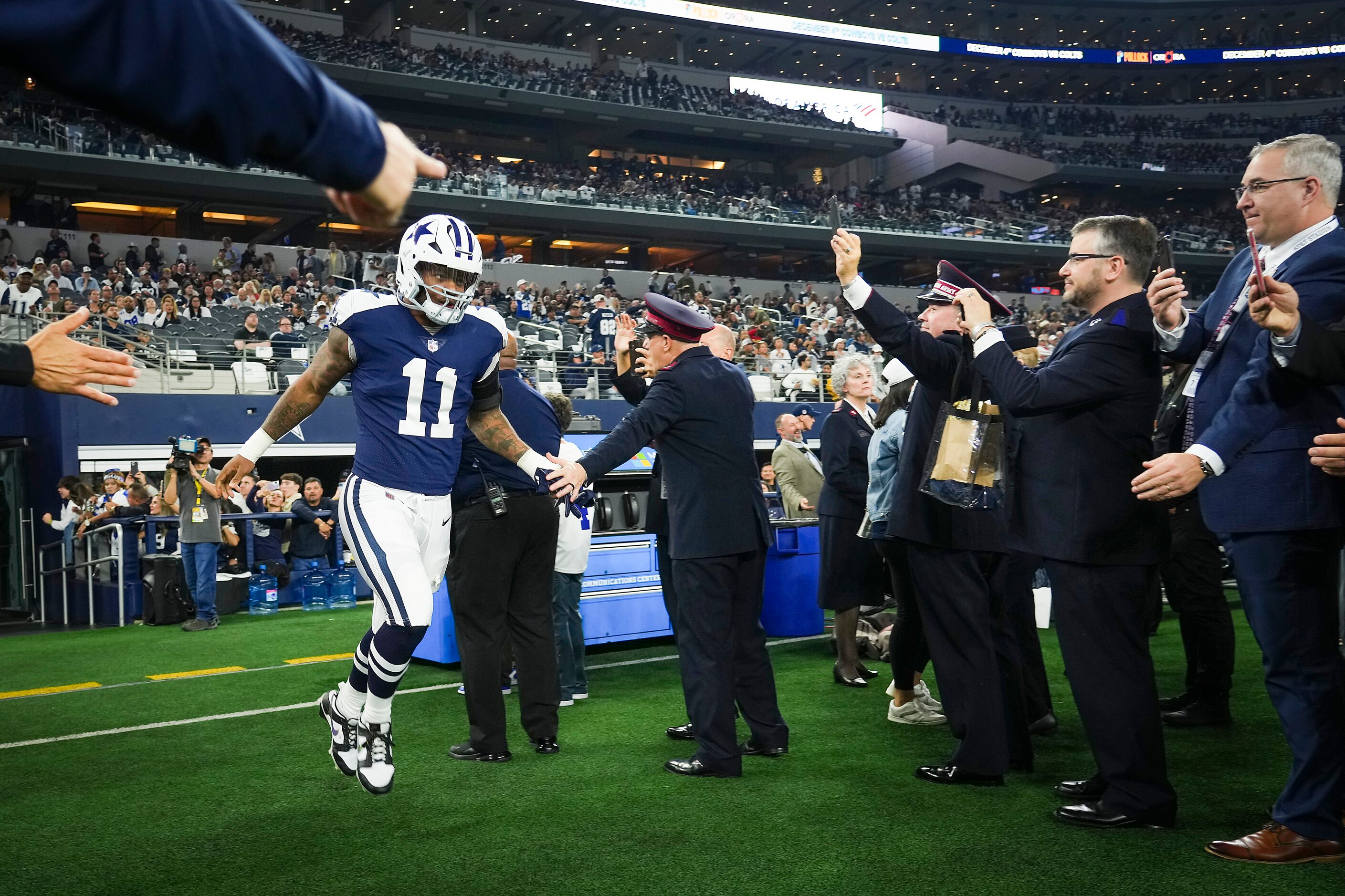 Dallas Cowboys linebacker Micah Parsons (11) takes the field to warm up before an NFL...