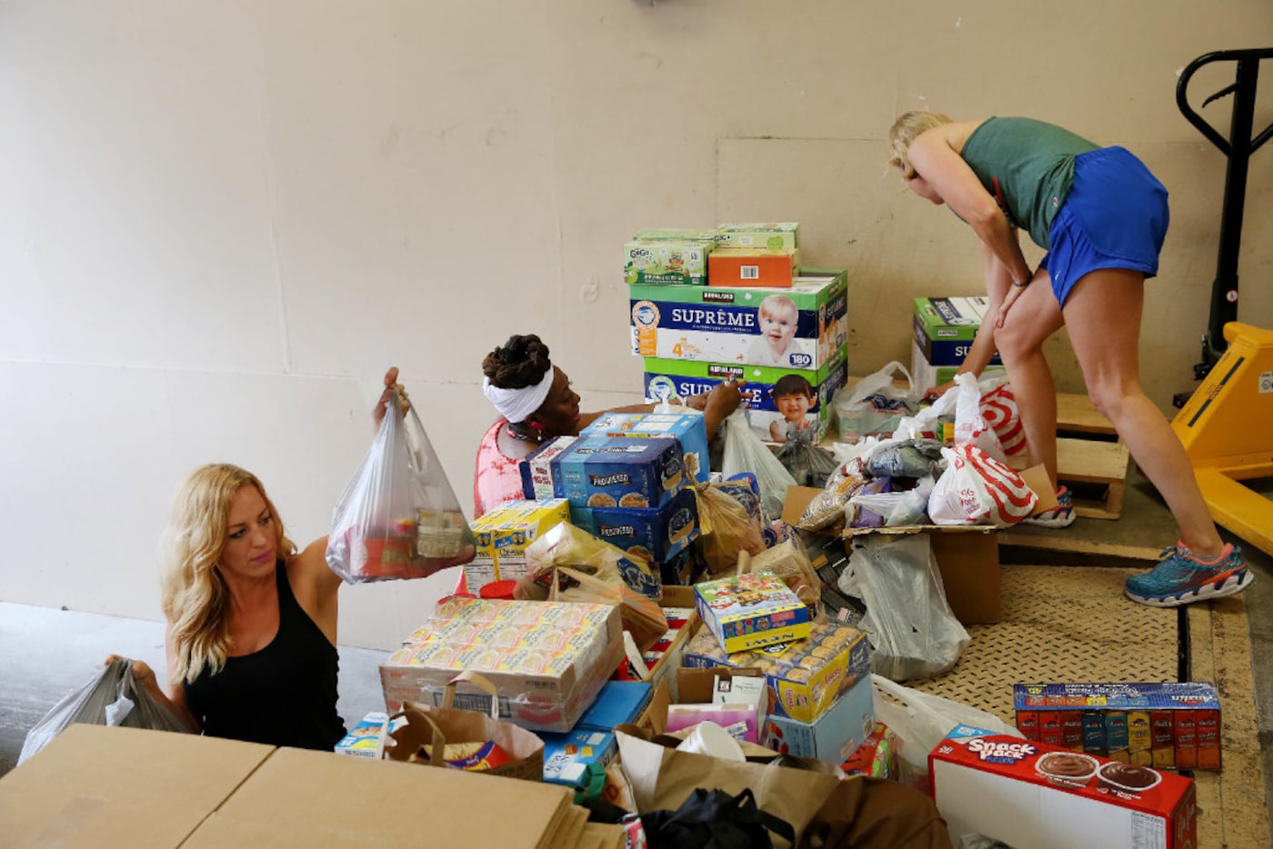 (From left) Taylor Grey, community relations director at Trusted World, Betty Reynolds of...