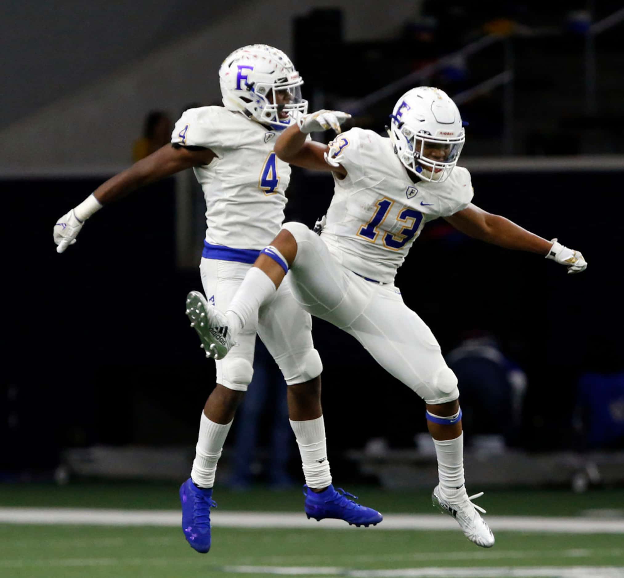 Frisco defender Chase Lowery (4) and teammate Blake May (13) celebrate Lowery's interception...