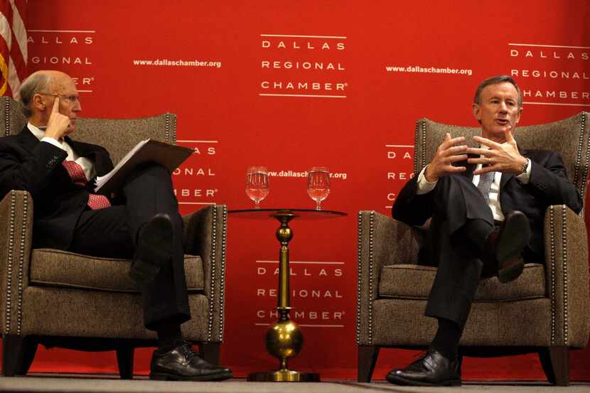 Admiral William H. McRaven, chancellor of the University of Texas System (right) is...
