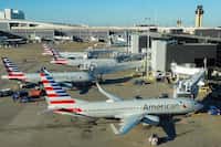 American Airlines planes are seen at the gates of Terminal D at DFW Airport on Monday, Feb....