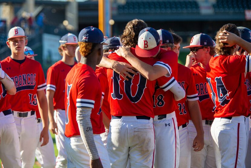 McKinney Boyd's Beau Brewer (10) is consoled by teammate junior Jack Hagan (18) after their...