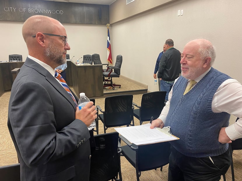 Brownwood Mayor Stephen Haynes (left) spoke to a resident at Brownwood City Hall on Oct. 25,...