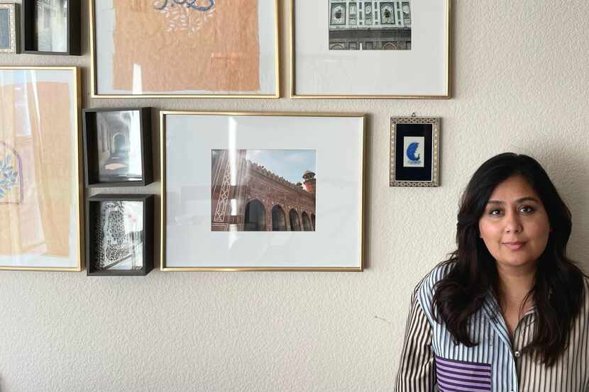Nosheen Iqbal stands by a Persian miniature painting featured in the dining room of her...