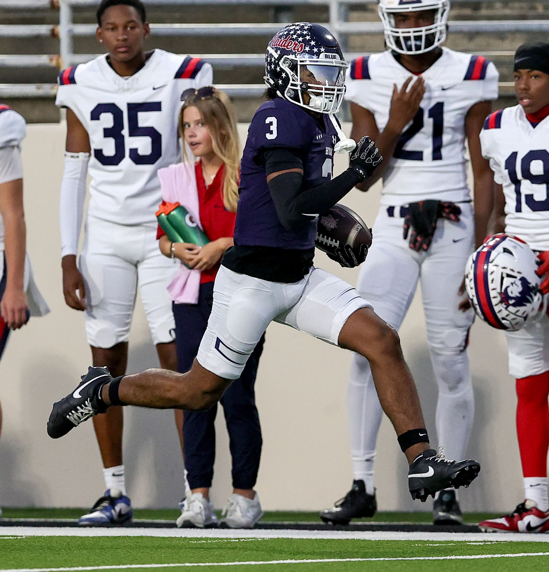 Denton Ryan wide receiver Lorenzo Hill goes down the sidelines for a 61 yard touchdown...