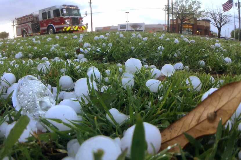  Marble-size hail fell alongÂ South Cooper Street in Arlington in March. (Ron Baselice/The...