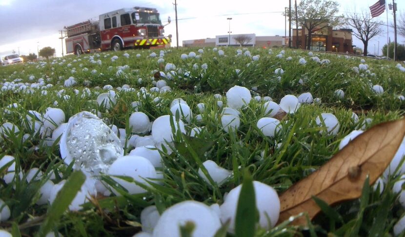  Marble-size hail fell alongÂ South Cooper Street in Arlington in March. (Ron Baselice/The...