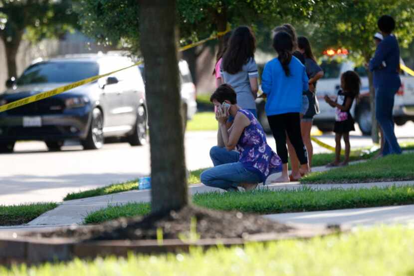 Neighbors gathered to watch Friday as the Fort Bend County Sheriff's Office investigated a...