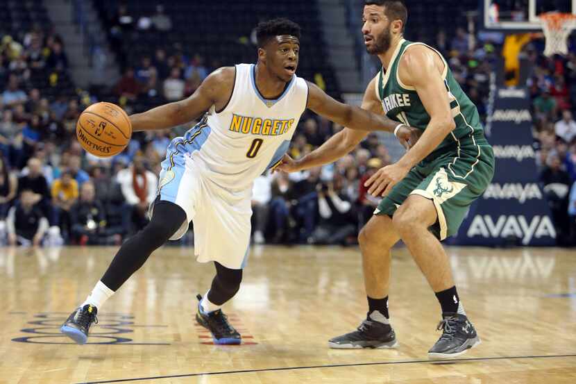 Nov 11, 2015; Denver, CO, USA; Denver Nuggets guard Emmanuel Mudiay (0) drives with the ball...