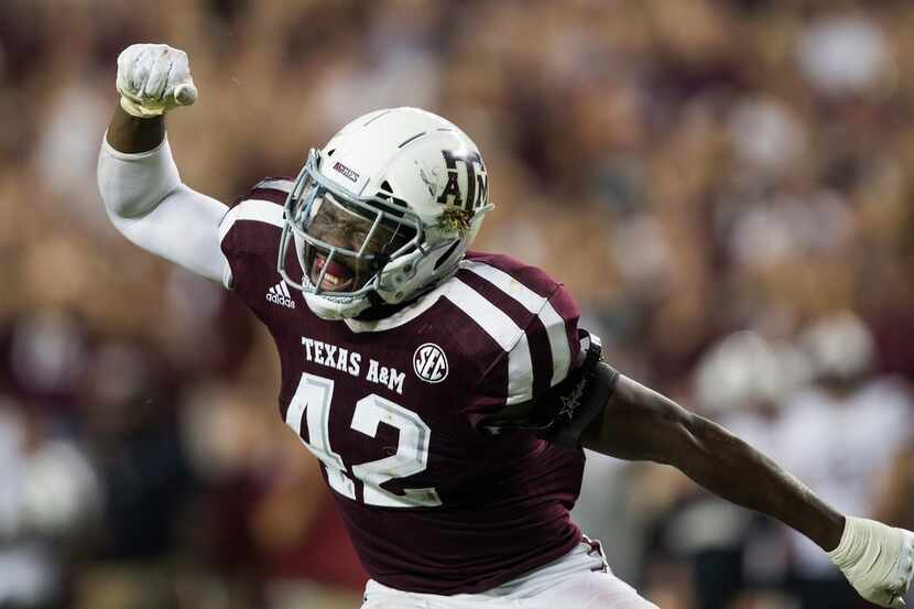 Texas A&M linebacker Otaro Alaka (42) reacts after sacking South Carolina quarterback Jake...