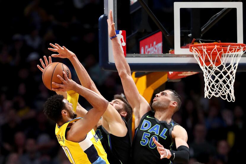 DENVER, CO - JANUARY 27:  Jamal Murray #27 of the Denver Nuggets goes to the basket against...