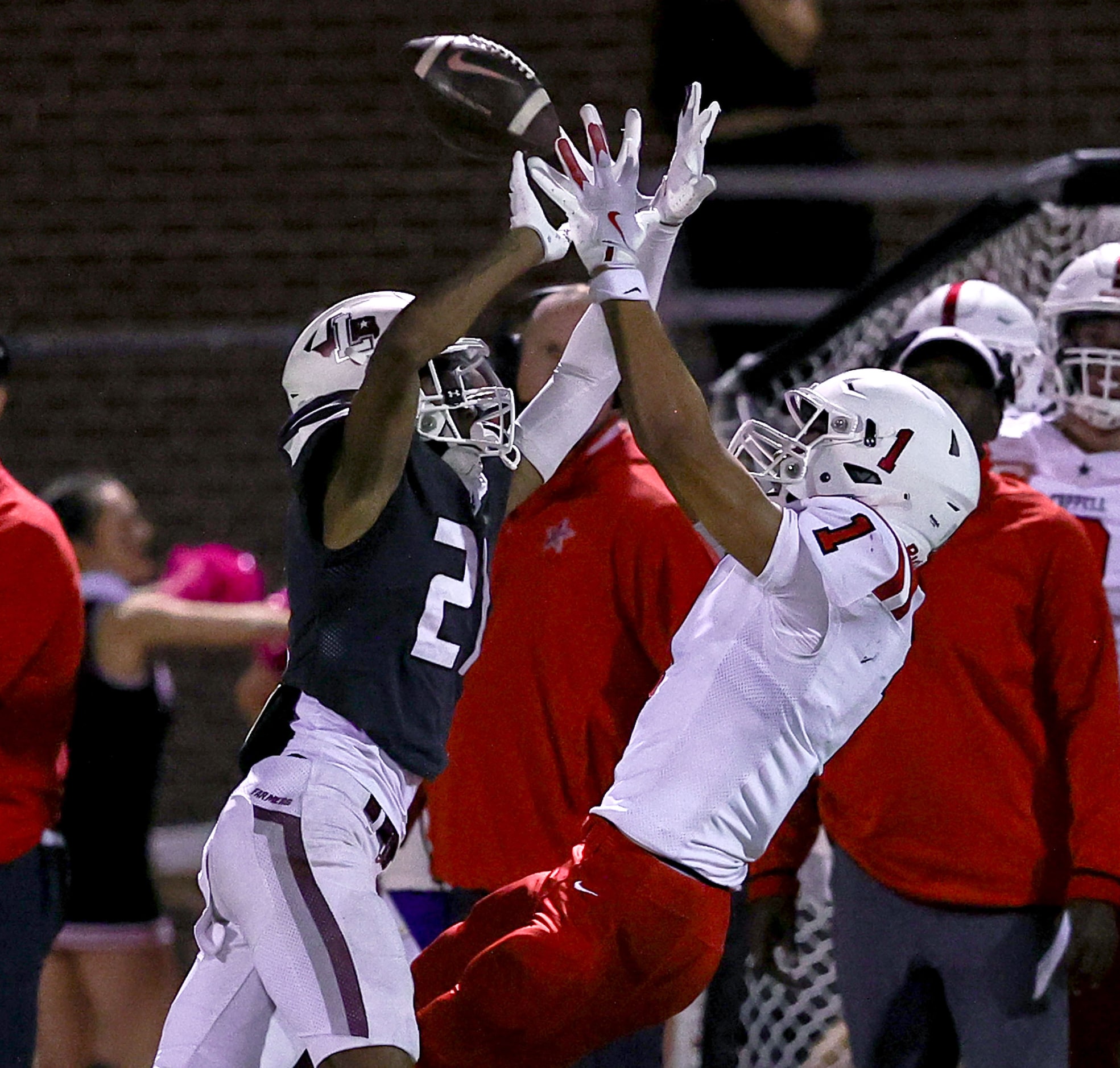 Coppell wide receiver Tucker Cusano (1) makes a great reception against Lewisville defensive...