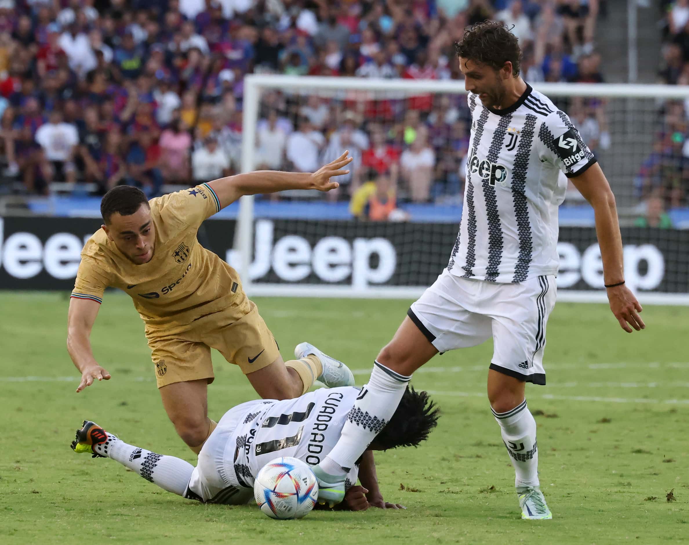 Barcelona forward Pierre Emeric Aubameyang (17) dives towards the ball over Juventus...