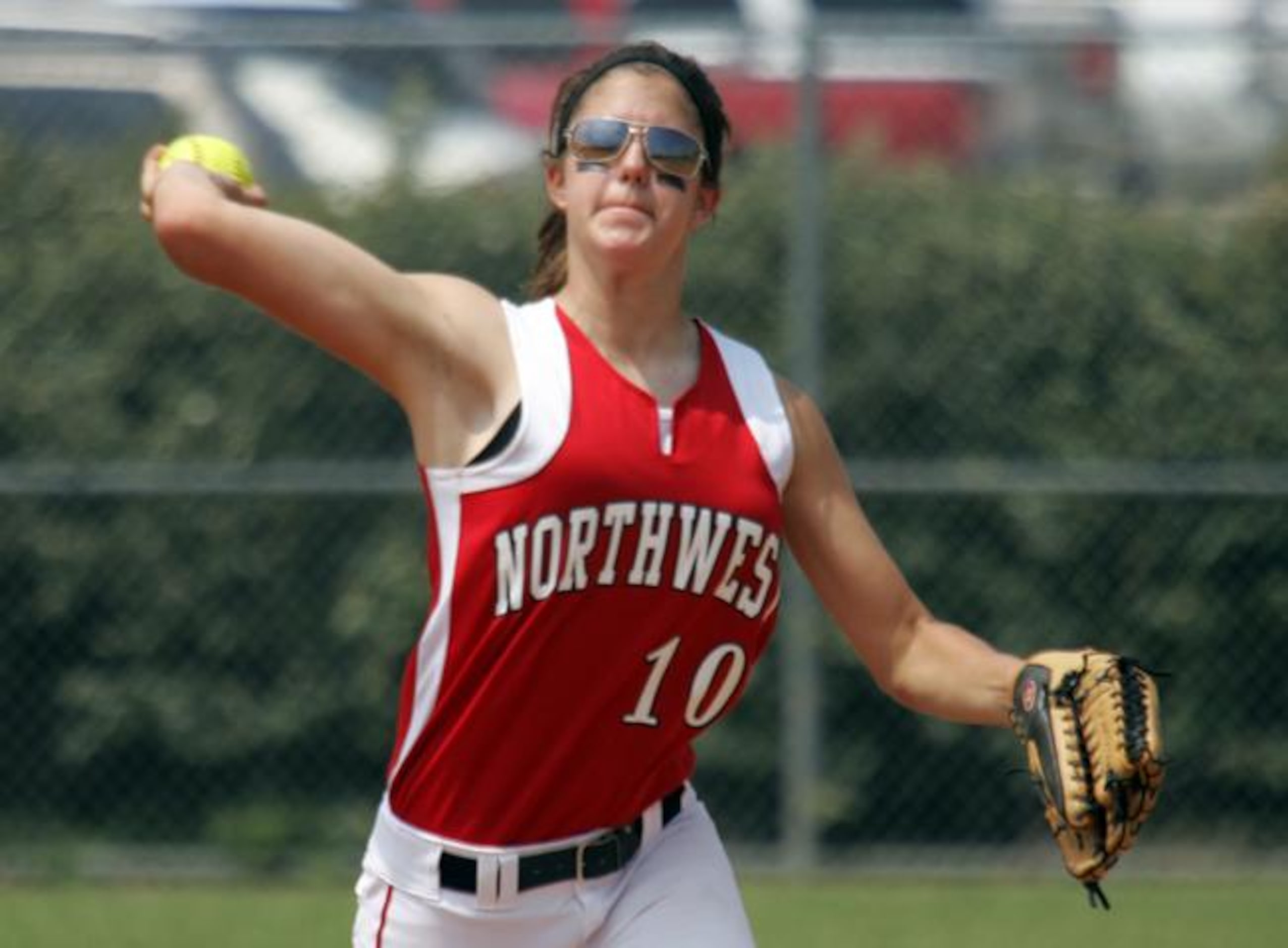 Justin Northwest sophomore Natalie Nimmo throws out a Coppell runner during Game 2 of their...