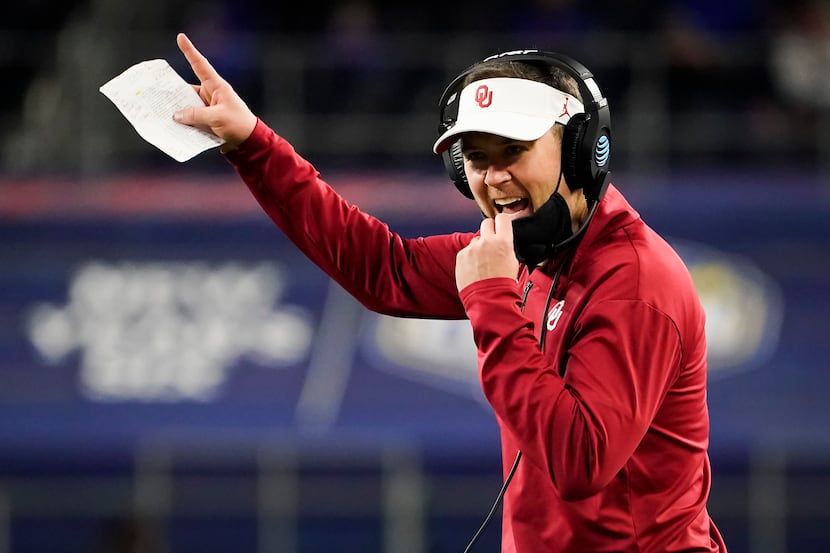 Oklahoma head coach Lincoln Riley calls in a play during the second half of the Cotton Bowl...