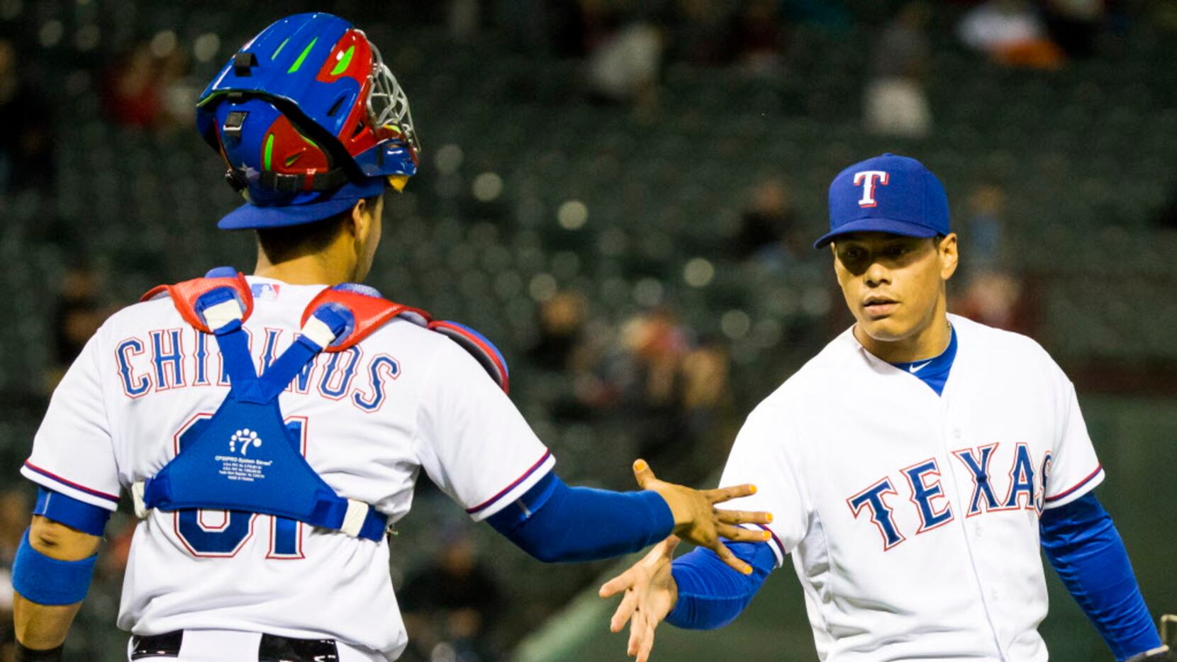 Texas Rangers relief pitcher Keone Kela gets a hand from catcher Robinson Chirinos after the...