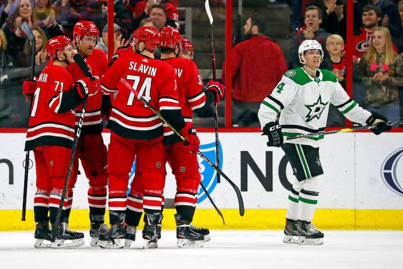 The Carolina Hurricanes celebrate a goal by Micheal Ferland late in the third period of an...