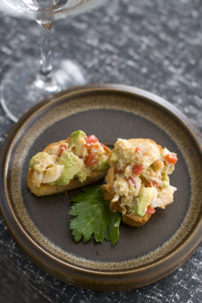 In this Feb. 13, 2012 photo taken in Concord, N.H., a recipe of avacodo and crab canapes...