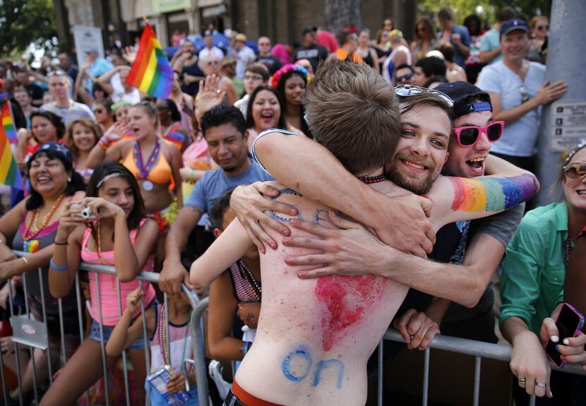 Dakota McKee of Palestine, Texas (with beard) receives a free hug from a Alan Ross Texas...