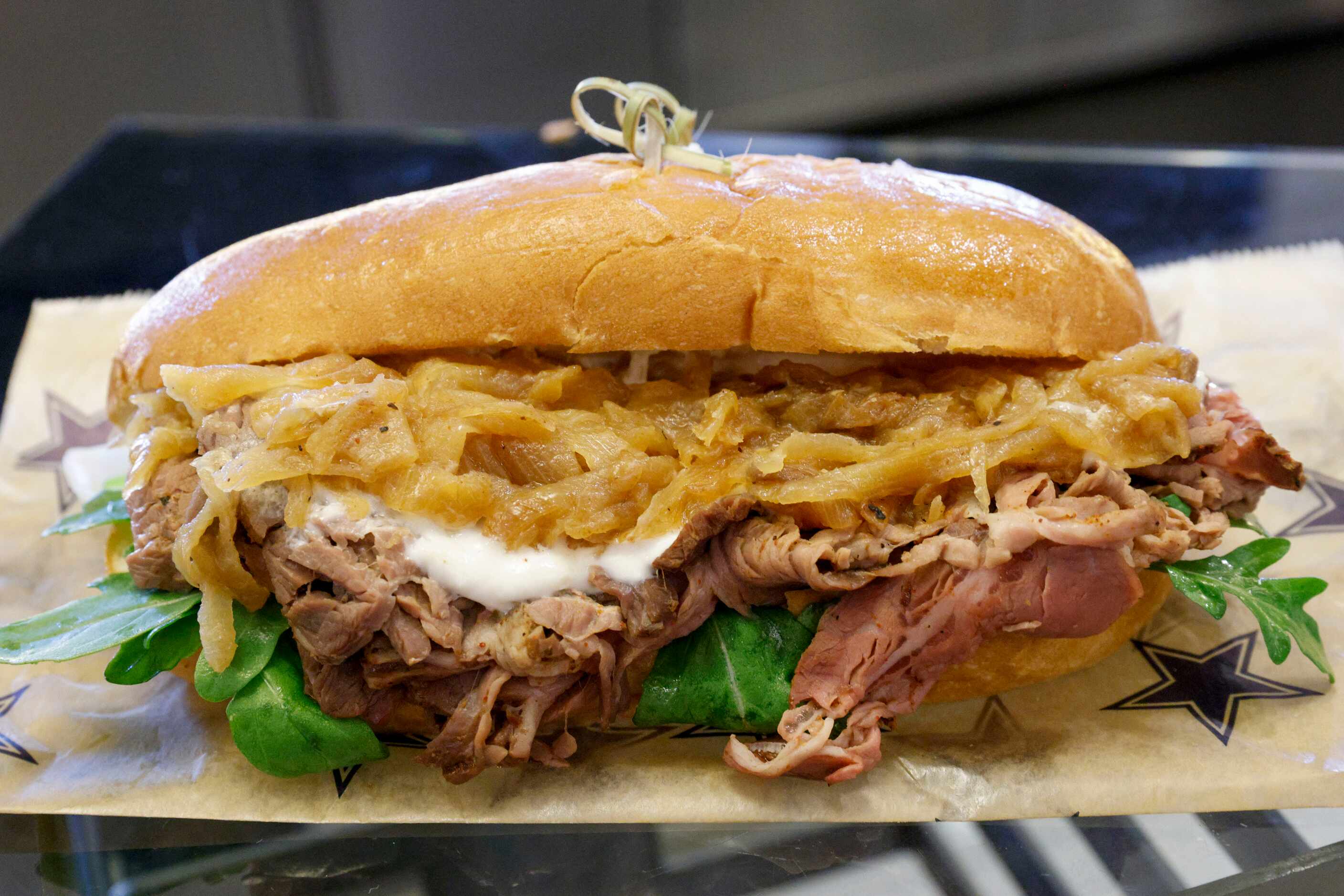 The steak sandwich at AT&T Stadium during Dallas Cowboys games comes with sliced beef,...
